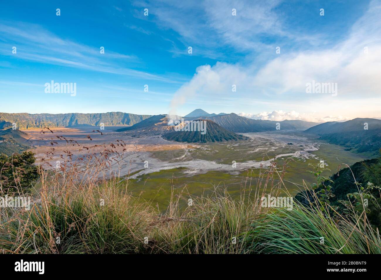 View of volcanic landscape, volcanoes, smoking volcano Gunung Bromo, Mt. Batok, Mt. Kursi, Mt. Gunung Semeru, Bromo-Tengger-Semeru National Park Stock Photo
