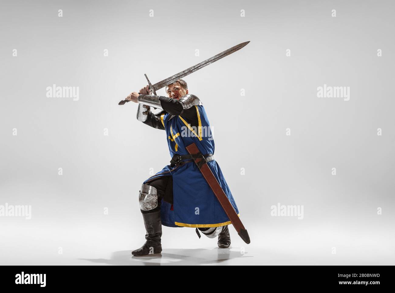 Brave armored knight with professional weapon fighting isolated on ...