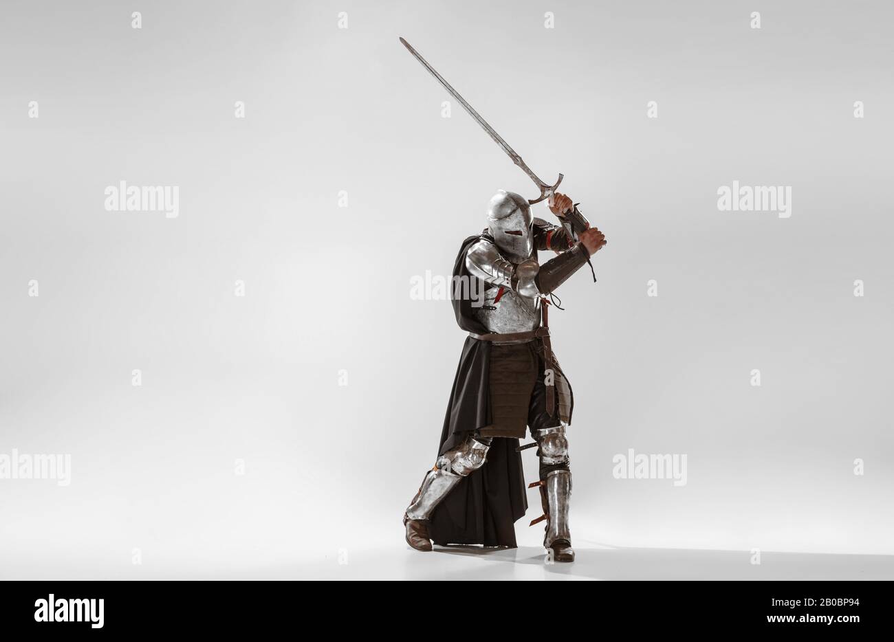 Brave armored knight with professional weapon fighting isolated on ...