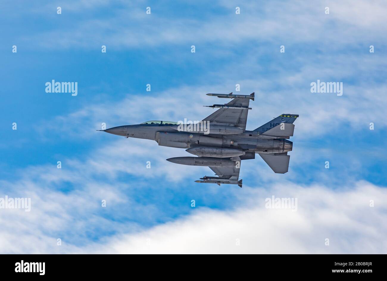 In this shot an F-16 Fighting Falcon banks right after it takes off from Hill Air Force Base in Layton, Utah, USA. Stock Photo