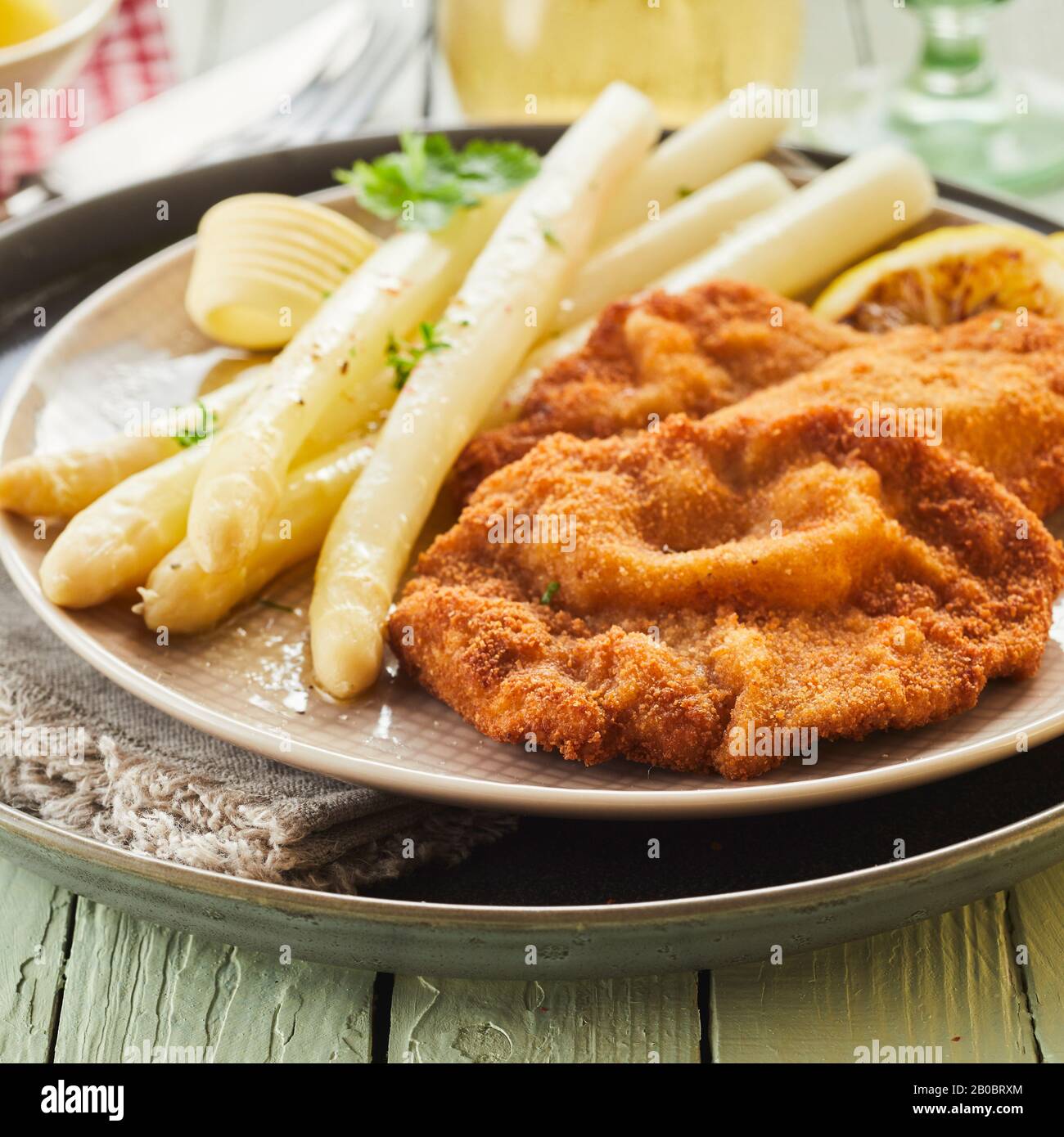 Canned white asparagus spears with breaded golden fried fish, fresh
