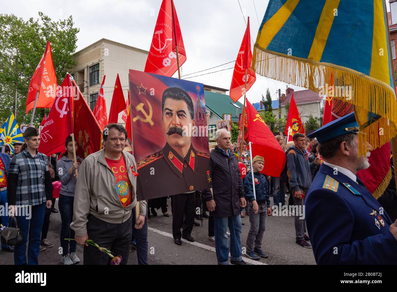 Anapa, Russia - May 9, 2019: People carry a portrait of Joseph Stalin along the streets of Anapa, at a festive procession dedicated to Victory Day on Stock Photo
