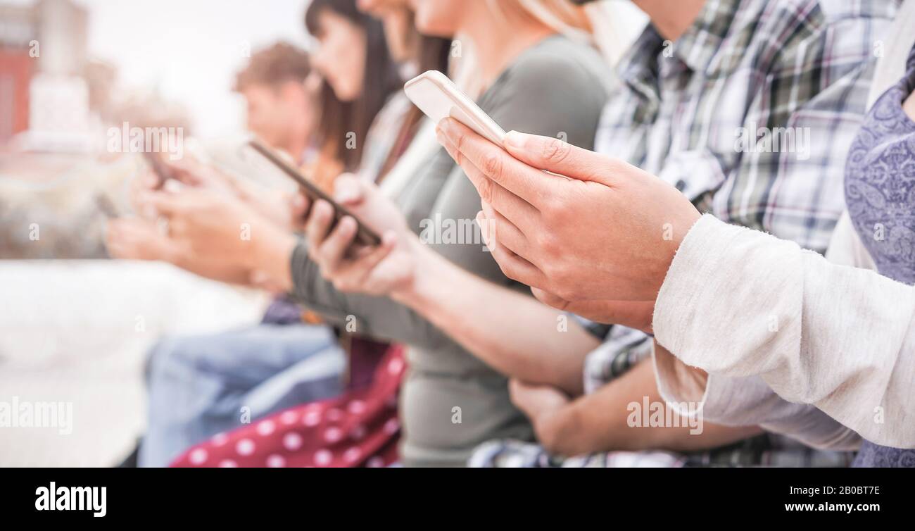 Young people using smart mobile phones - People addiction to new ...