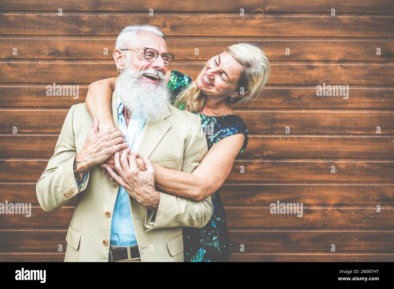Happy senior couple having fun outdoor - Mature people laughing and having tender moments - Love, fashion and joyful elderly active lifestyle concept Stock Photo