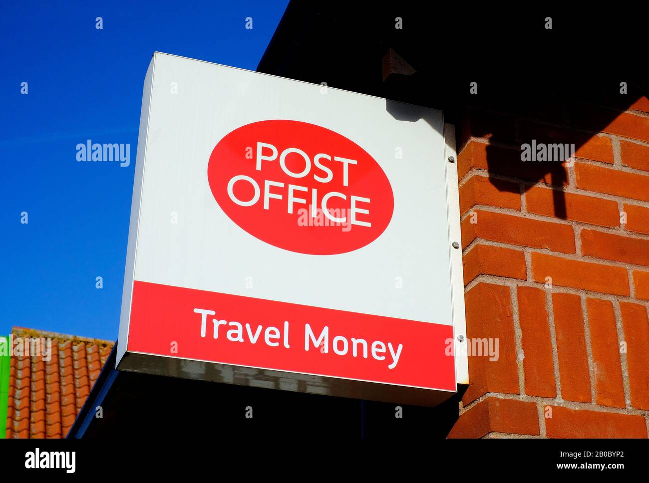 post office travel money sign outside shop, norfolk, england Stock Photo