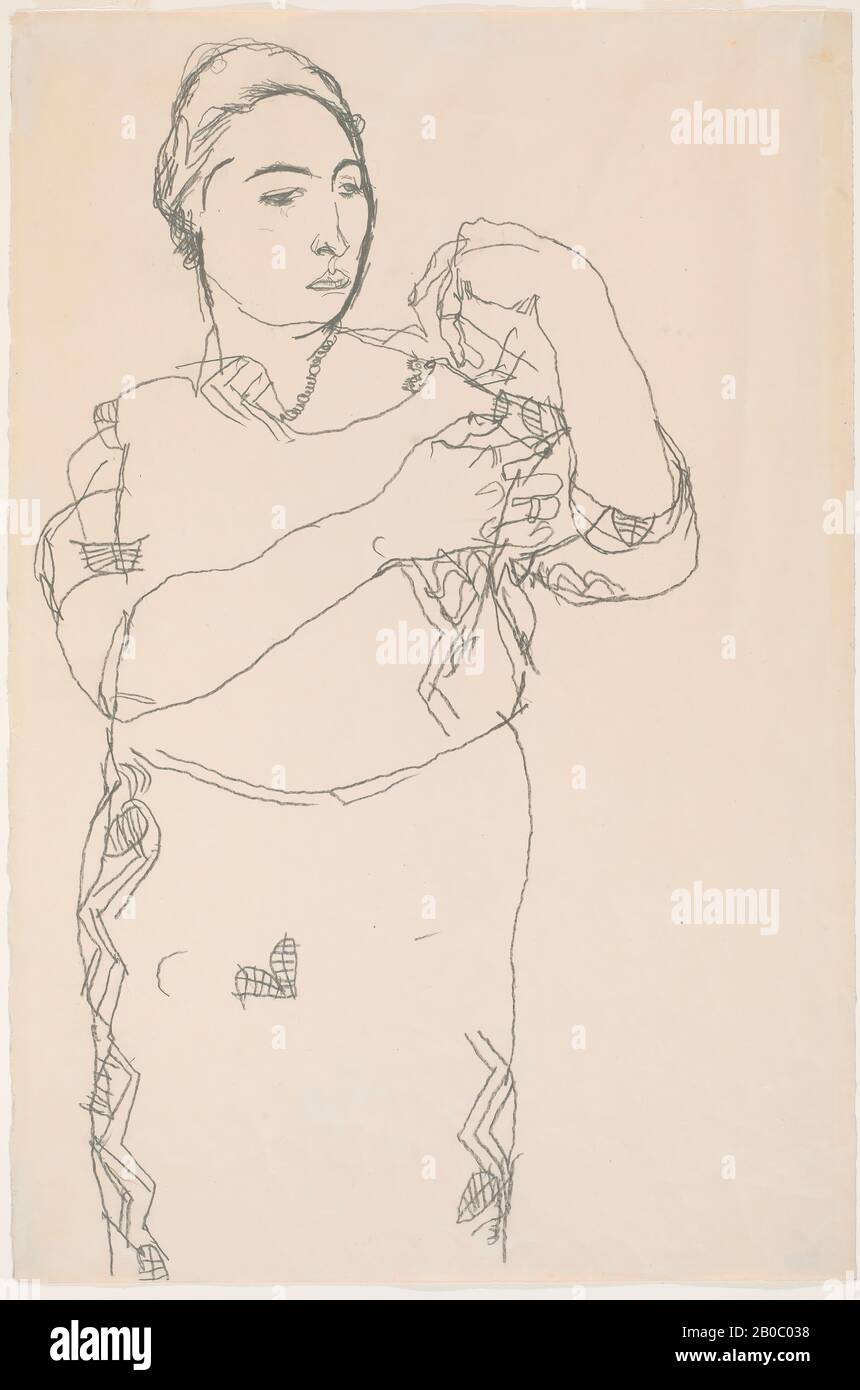 Egon Schiele, Standing Woman, Study for 'Portrait of Friederike Beer-Monti', 1914, graphite on paper, 19 in. x 7 1/2 in. (48.2 cm. x 19 cm.), Friederike Maria Beer, the subject of this portrait, is the only person to be painted in oil by both Gustav Klimt and Egon Schiele. An ardent fan of the Wiener Werkstatte, Beer recalled that all her clothing was designed by their fashion department. The Werkstätte's distinctive fabric patterns are recognizable in both the Schiele and the Klimt portraits. However, Schiele apparently had trouble building a composition around the? zigzag stripes of Beer's d Stock Photo