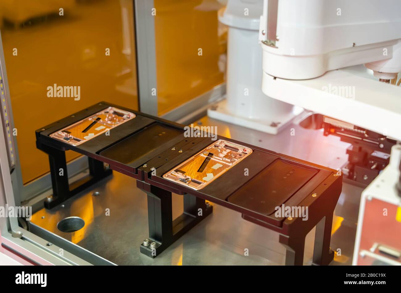 intelligence machine working in phone factory Stock Photo