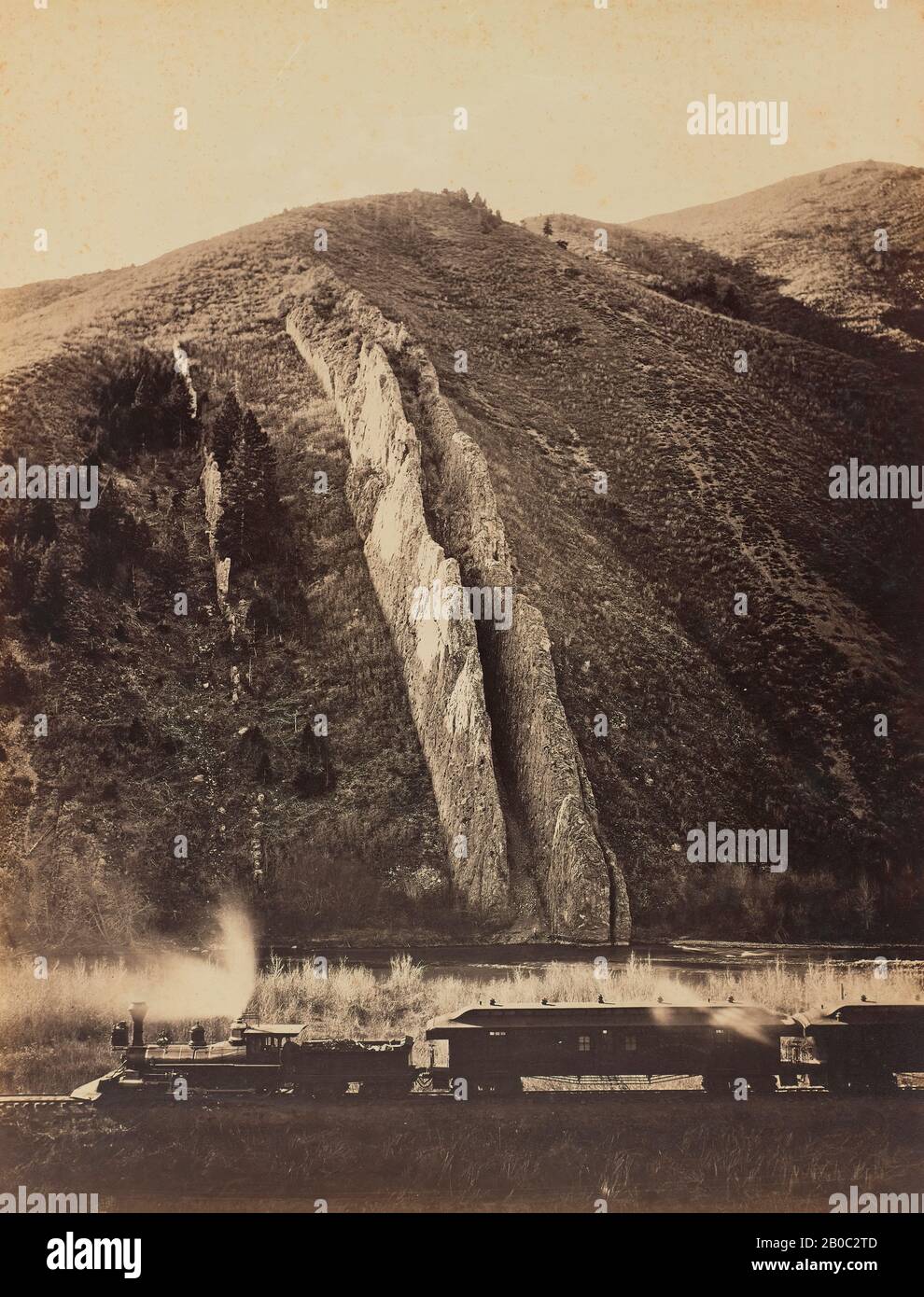 Carleton Emmons Watkins, Devil's Slide Utah, U.P.R.R., 1873-1874, albumen print, 20 9/16 in. x 15 13/16 in. (52.3 cm. x 40.1 cm.), The late-nineteenth century West was the age of the railroad and photography. Carleton Watkins combines both in this iconic picture. Drawn west in 1851 by the Gold Rush, he stayed in California, where his scenic photographs helped to build support for Yosemite National Park. Yet Watkins also supported himself by photographing for mining and railway companies. Devil's Slide Utah, U.P.R.R. captures the ambiguities of Watkins's dual roles. Two parallel but off-kilter Stock Photo