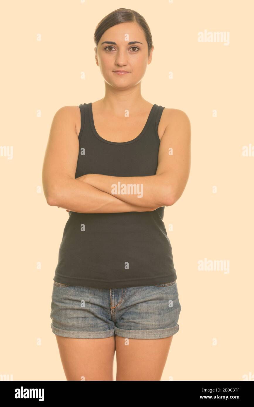 Pretty woman standing crossed arms hi-res stock photography and images ...