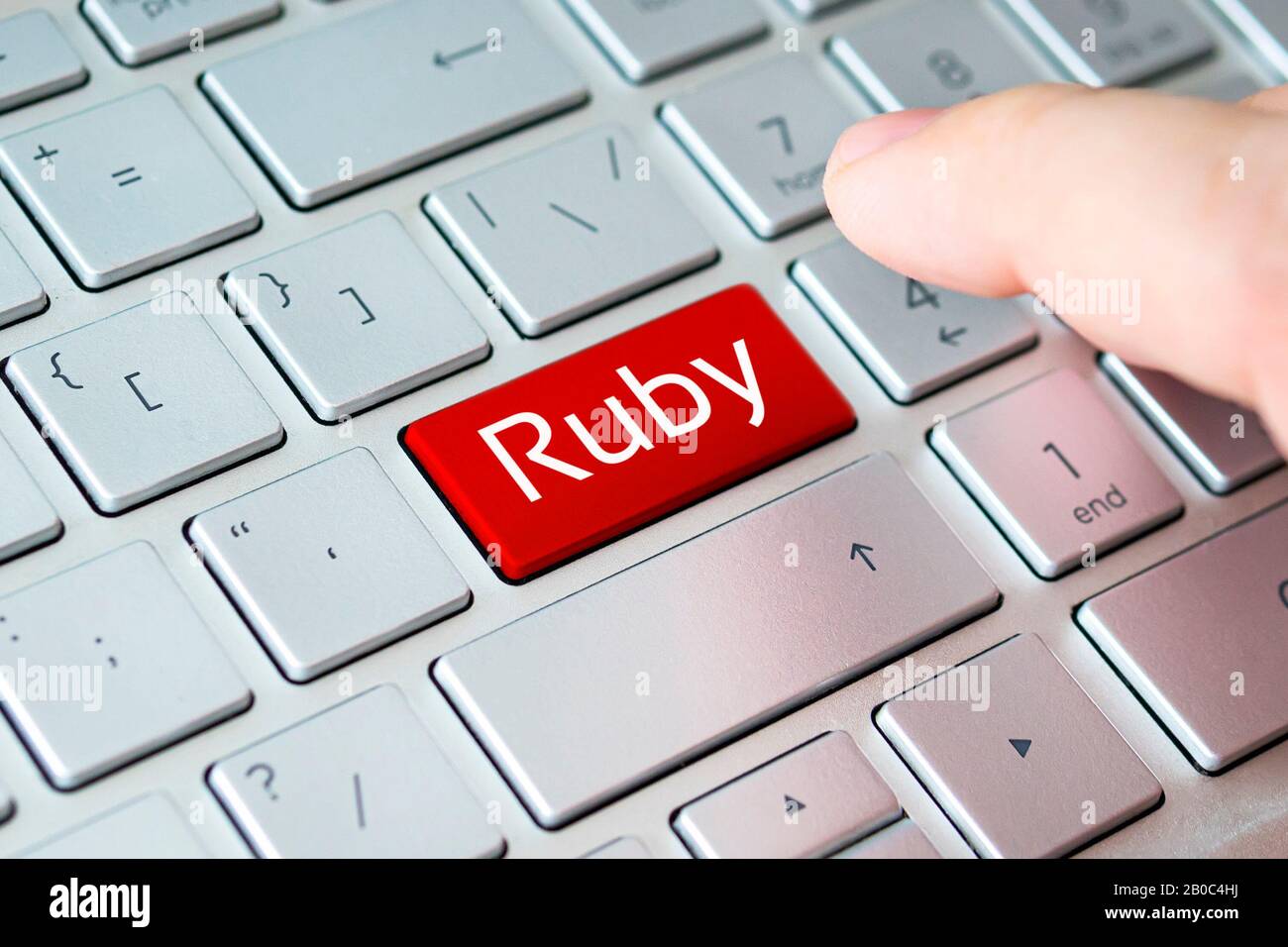 button with the ruby on the grey keyboard of a modern laptop. Stock Photo