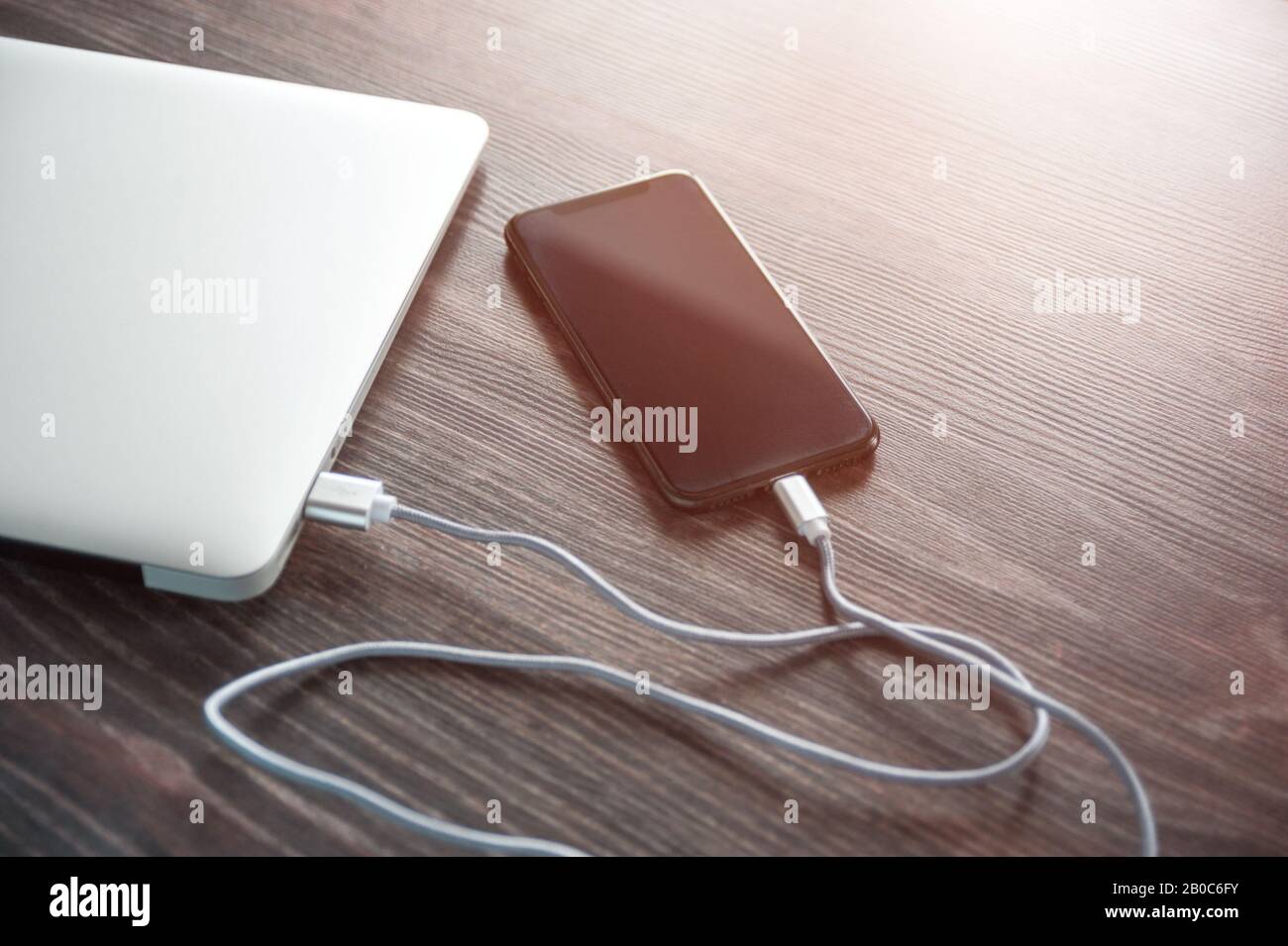 The phone is charged from a laptop. Charging your phone when there is