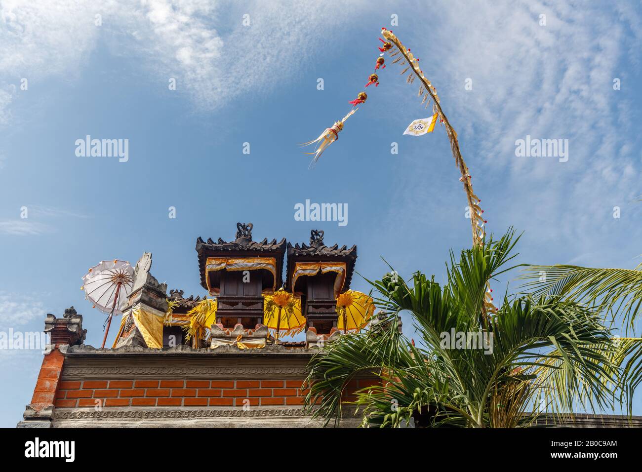 Sanggah Kemulan Rong Family Temple On The Roof Of Traditional Balinese House Penjor Poles For Galungan Celebration Bali Indonesia Stock Photo Alamy