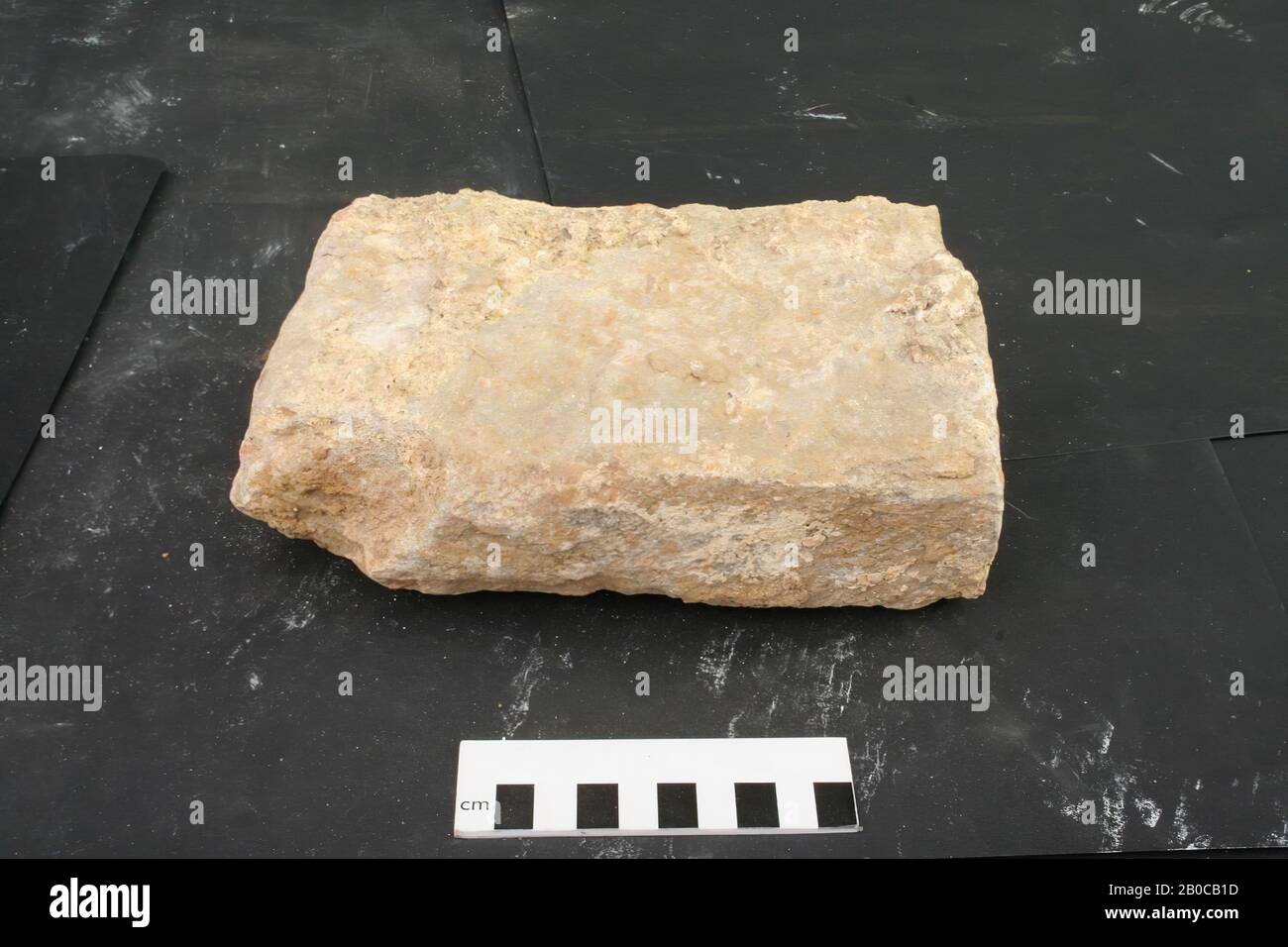 Building fragment of stone with mortar remains., Building fragment, stone, mortar, 21 x 12 x 7 cm, 4 kg, Netherlands, Limburg, Heerlen, Heerlen Stock Photo