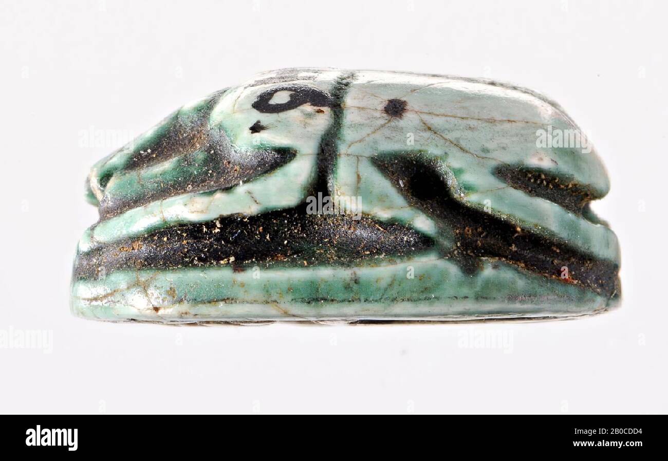 scarab, Amon, sun, chevre sign, The seal has the shape of a stylized scarab. Clypeus, head, pronotum and elytra are separated by notched lines. Legs are shown on both sides. The forward front legs and the backward centered legs come together under the dividing line between pronotum and elytra. The back legs that are turned back start under the elytra. All legs rest on an oval base whose bottom serves as a sealing surface. In the sealing area, two names can be read beneath a winged solar disk: the thornmother of Thutmose III, men-cheper-re. This name is in cryptography a spelling for the god Stock Photo