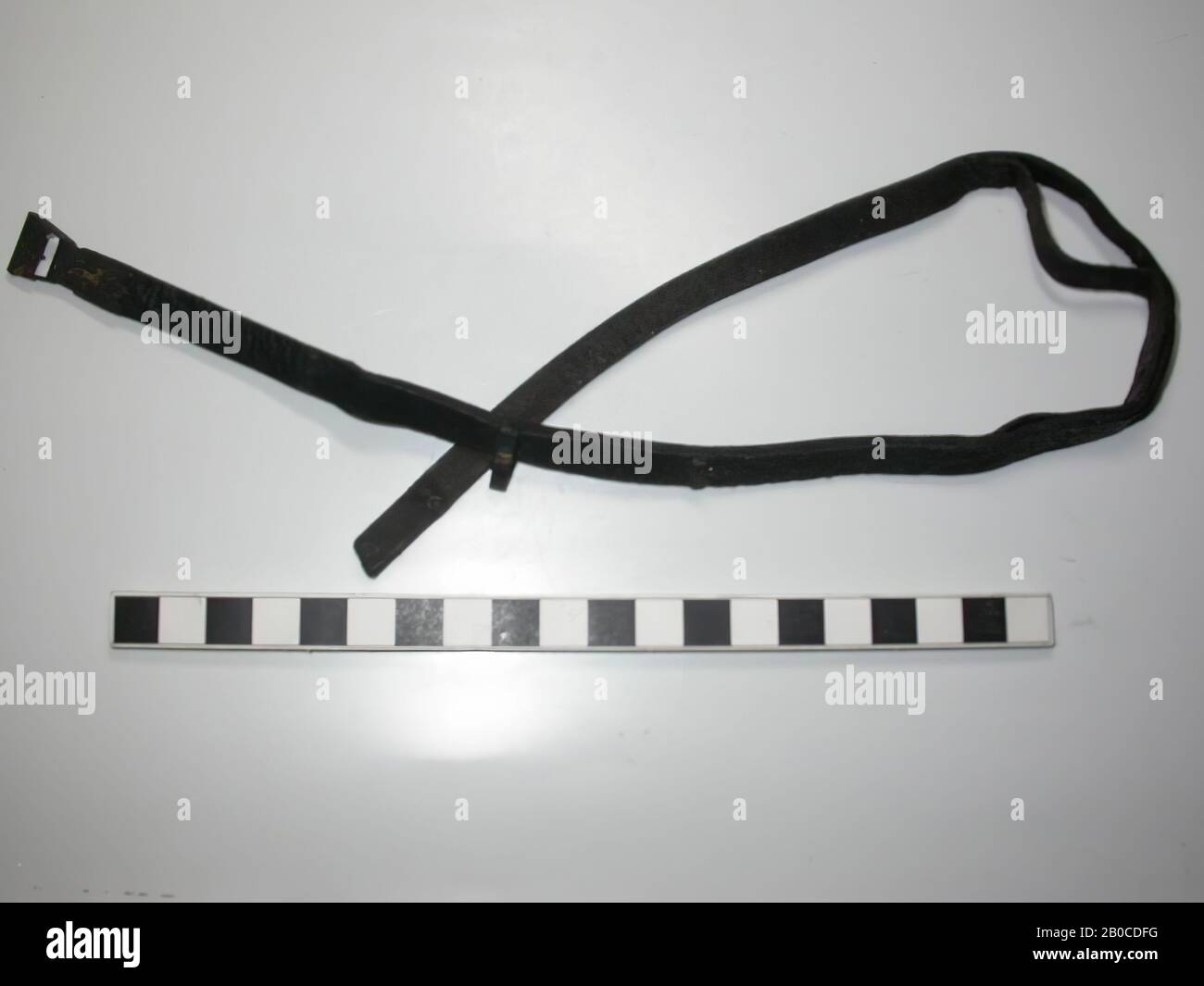 Belt with fittings. Leather belt with three bar-shaped black fittings (lead Stock Photo