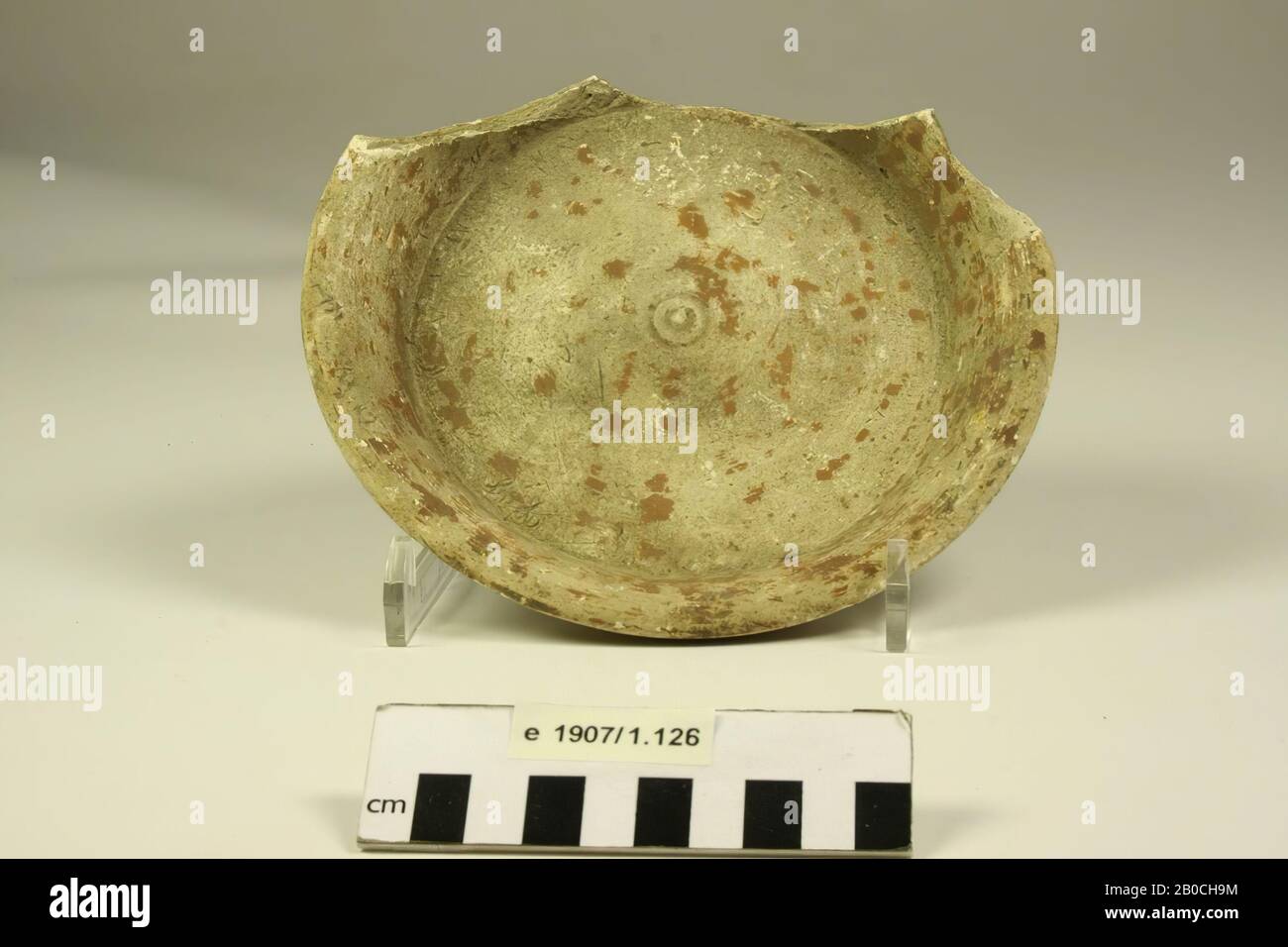 Dish, earthenware. The red sludge on the surface is damaged. Approximately 1 Stock Photo