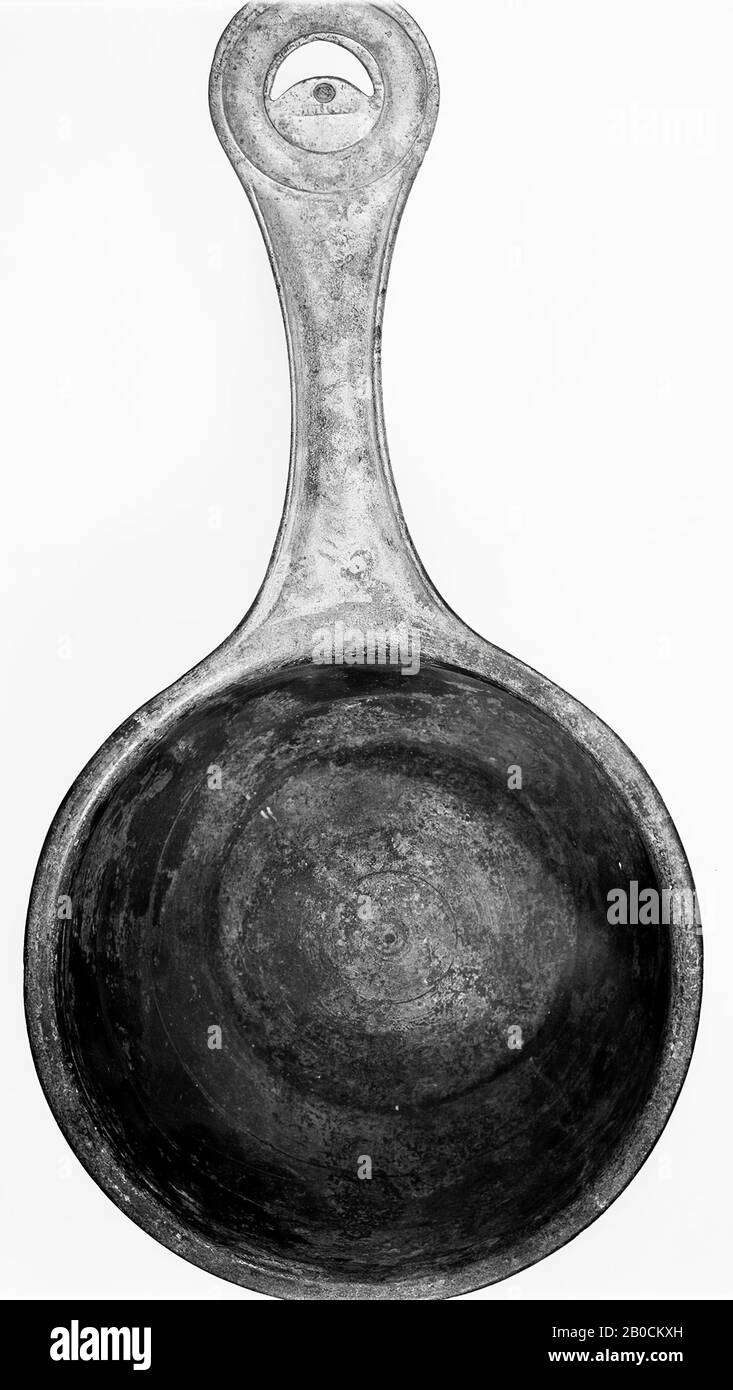 Low bronze casserole with a narrowed profiled stem in the middle, ending in a round profiled disc with crescent-shaped hole in the center. Low curved wall with excellent edge. Underneath a groove on the outside. On the wall within 3 grooves all around. On the bottom inside 2 circular grooves. Heavily turned soil. Covered with white metal on the inside and on the outside to below the edge. Brownish patinated. Stamp on the disk: CIPIPO ^ I. (^ = labda). Stamp in the longitudinal direction of the stem unreadable., Crockery, casserole, metal, bronze, 5.5 x 25.5 cm, Roman 70-80, Netherlands Stock Photo