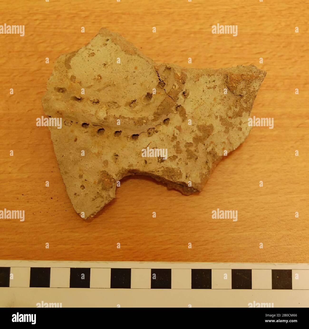 Earthenware fragment with a thickening with uniform dots along it (decoration), cultic vessel with hanging decoration ?, crockery, earthenware, L 11.6 cm, W 9.85 cm, thickness 2.1 cm, Iron Age 1150-539 BC, Jordan Stock Photo