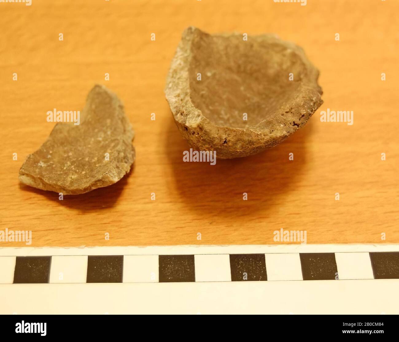 Fragment of an alabaster jar, burnt remains, broken into two fragments, crockery, stone, alabaster, L 7.7 cm, W 5.15 cm, H 6 cm, Iron Age I, phase G 1150-1050 BC Jordan Stock Photo