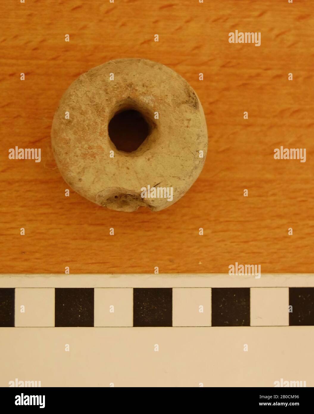An earthenware ring or weight, grave inventory, tools, pottery, D 3.8 cm, D hole 1 cm, H 2.15 cm, Iron Age 1150-539 BC, Jordan Stock Photo