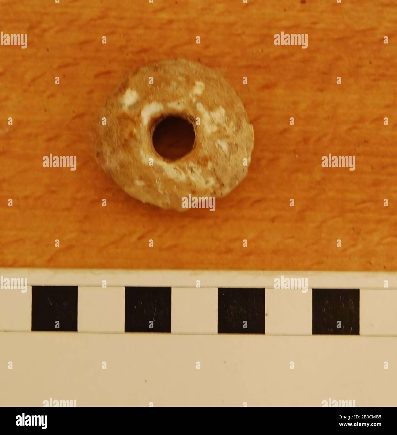 An alabaster spindle, grave inventory, tools, stone, alabaster, D 3.4 cm, D hole 0.95 cm, H 1.3 cm, 1150-539 BC, Jordan Stock Photo