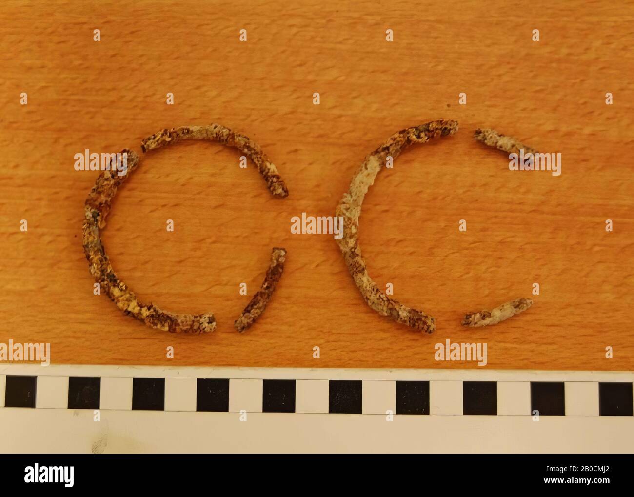 At least two iron bracelets, six fragments, corroded, grave inventory, ornament, iron, Largest fragment: D 6.6 cm, H 0.6 cm, Islamic Period 1250-1600 AD, Jordan Stock Photo