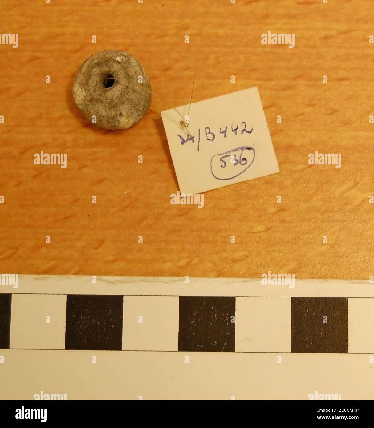 A round stone bead, grave inventory, ornament, stone, D 1.4 cm, D hole 0.3 cm, Islamic Period 1250-1600 AD, Jordan Stock Photo