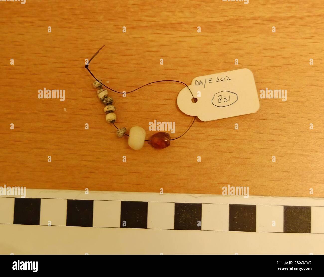 Six small, round glass beads, an annular stone bead, an oval bead of carnelian, grave inventory, ornament, glass, carnelian, stone, L 0.7 cm to 0.3 cm, Islamic Period 1250-1600 AD, Jordan Stock Photo