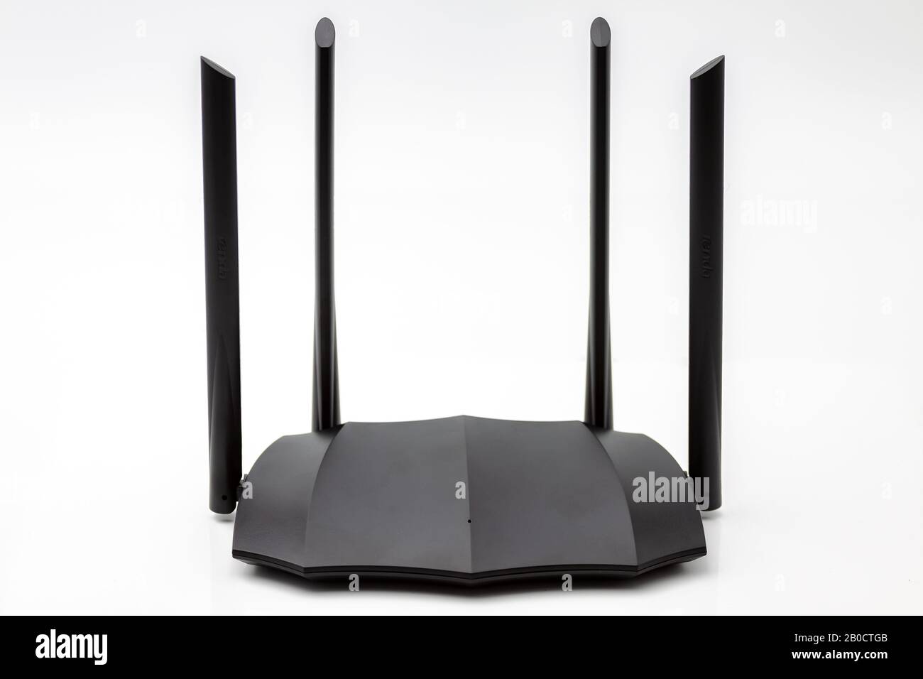 Home dual band gigabit wifi router transmitting high speed internet.Selective focus with shallow depth of field. Stock Photo