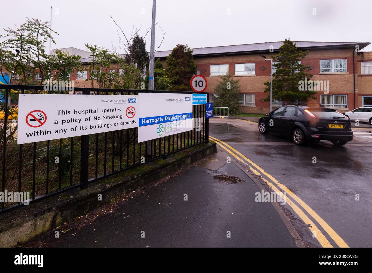 The entrance to Harrogate District Hospital, North Yorkshire, as workmen install three coronavirus assessment pods in the grounds. Stock Photo