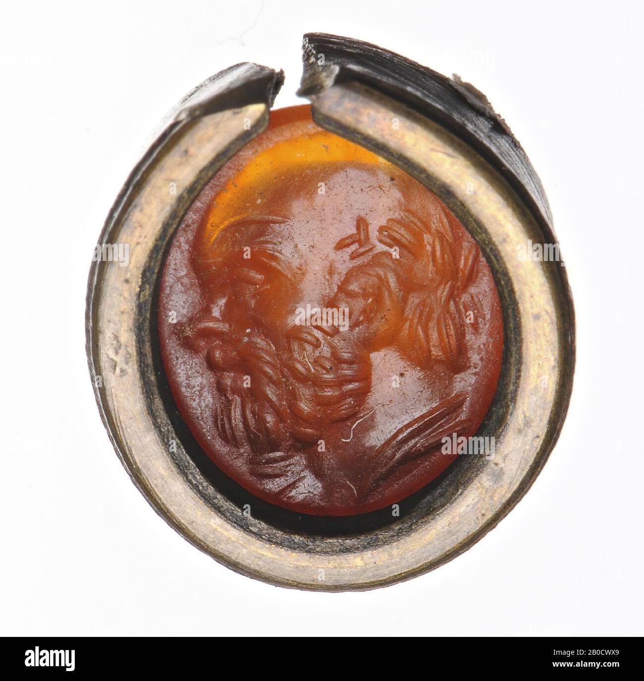 Vz: the bald and bearded head is part of a dressed bust., Gem, intaglio, ringstone, carnelian, Color: orange-red, Shape: oval, Processing: in modern copper setting, Method: modeling with large rounded drill , detailing with short rounded wheel grooves., 11.5 x 10 mm, D. 2 mm, 2nd half 1st century BC. -50 Stock Photo