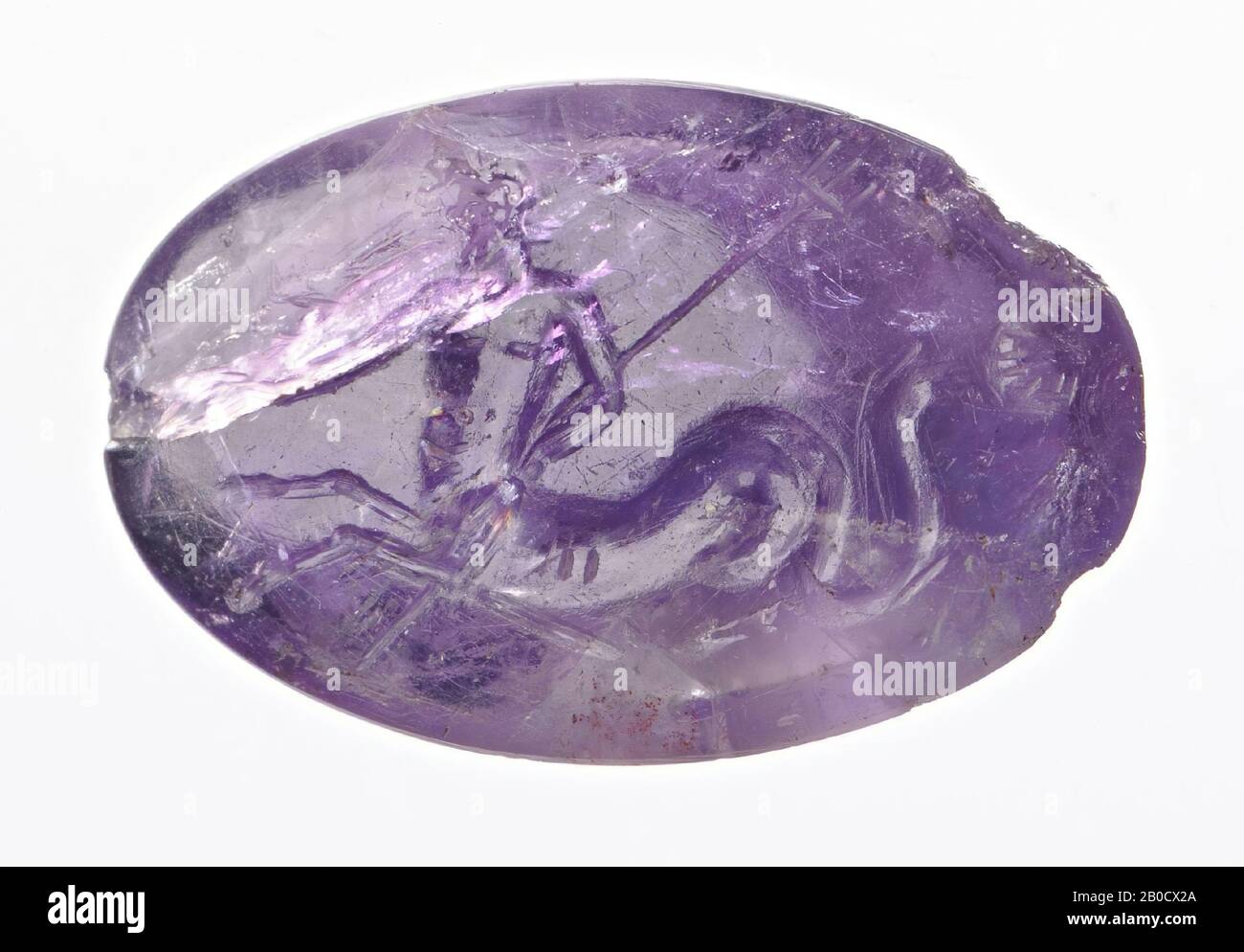 Vz: a bearded triton with a large decorative fish tail has a long shell in its right hand and in its left hand a trident that runs strangely behind the body., Gem, intaglio, ringstone, amethyst, Color: purple, Form : oval, Machined: Maaskant-Kleibrink, M., Catalog of the engraved gems in the Royal Coin Cabinet, 1978, p.60, fig.2, type F1, front convex, edge at the back cut backwards compared to front, 22 x 13 mm, D. 4.5 mm, 50 BC. - 25 AD. -50 BC Stock Photo