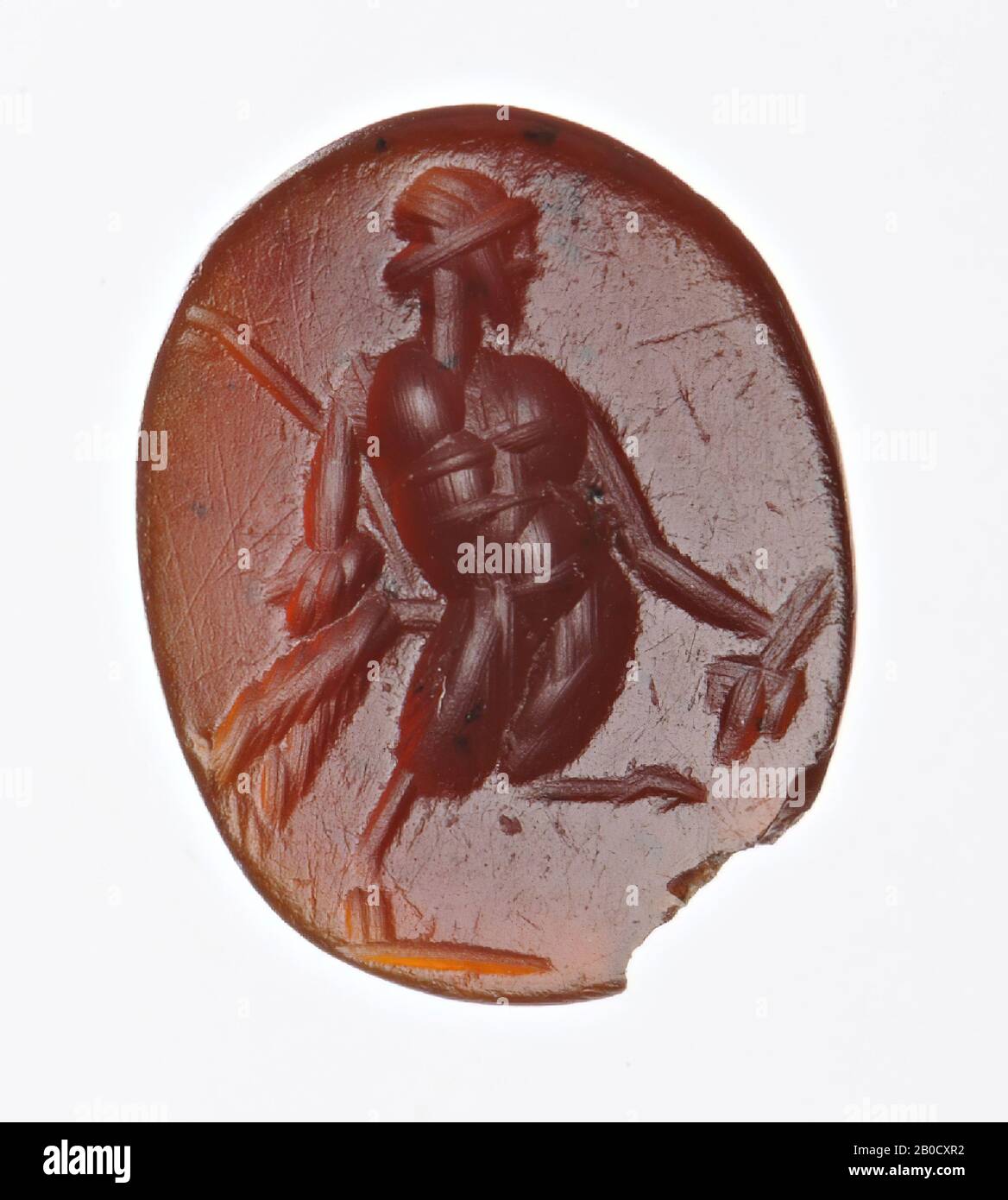 Vz: the god has a bunch of grapes in his right hand and a pedum and nebris in his other hand., Gem, intaglio, ringstone, carnelian, Color: dark red, Shape: oval, Processing: edge at front cut back Compared to the rear, Method: streaky body modeling with large rounded drill, detailing with several rounded wheel grooves, 12 x 9 mm, D. 3 mm, 1st - 2nd century AD. 1-200 AD Stock Photo