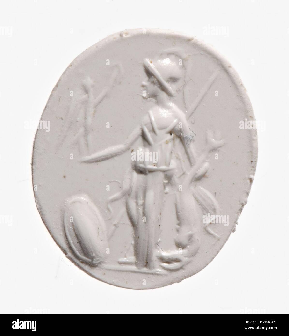 Vz: the goddess wears a helmet with comb and a big change (apoptygma), on her outstretched left hand a Nike-Victoriola, in her right hand she has a big dolphin at the tail, the dolphin is upside down pictured, behind the goddess a spear and for her a shield., gem, intaglio, ringstone, carnelian, Color: orange-red, Shape: oval, Processing: edge at the back receded compared to front, Method: streaky body modellig with rounded drills, detailing with streaky rounded wheel grooves., 13 x 10 mm, D. 2.5 mm, 1st century AD. 1-100 AD Stock Photo