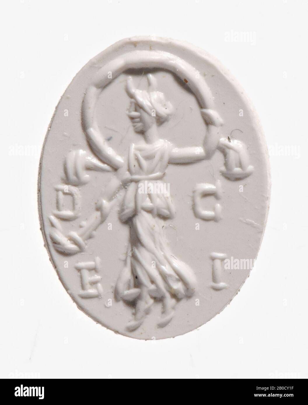 Vz: the floating goddess is dressed in a peplum with cover (apoptygma), she has a crescent moon on her head, she has a velum above her with her right hand, with her left hand she points a torch down. , gem, intaglio, ringstone, heliotrope, Color: green with red speckles, Shape: oval, Processing: edge cut back at the back compared to the front, Method: modeling with thick rounded wheel grooves., 12 x 9 mm, D. 2,5 mm, 1st - 2nd century AD. 1-200 AD Stock Photo