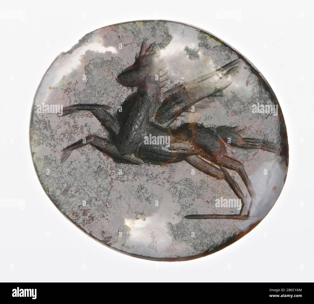 Vz: the horse has its hind legs on the ground, the forelegs are stretched out in the air., Gem, intaglio, ringstone, heliotrope or agate, Color: red, Shape: round, Processing: back convex, coarse streaky rendering with a thick rounded wheel, no detailing., 12 x 7 mm, D. 2 mm, 2nd - 3rd century AD. 100-300 AD Stock Photo