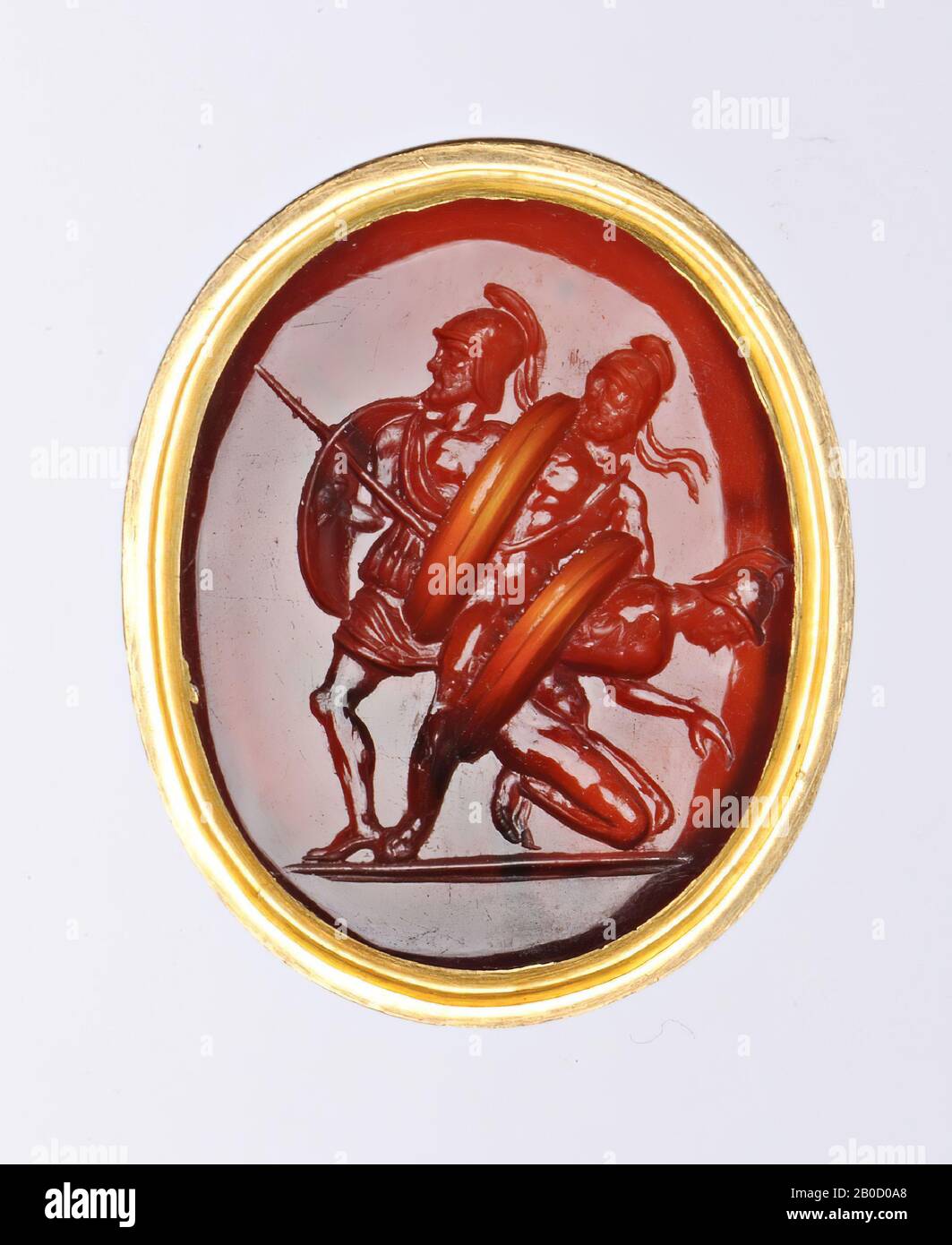 Vz: 3 warriors in a row, the left figure kneeling to the left with a bowed head and shield on back, middle figure standing to the right in receding posture, hiding behind his shield, the right figure attacking to the right with spear and shield, gem, intaglio, carnelian, Color: red-brown, Shape: oval, standing, Processing: in gold ring, Type :, 25 x 19 mm, D. 4 mm, wt. 9.43 gr., 18th century 1700-1800 Stock Photo