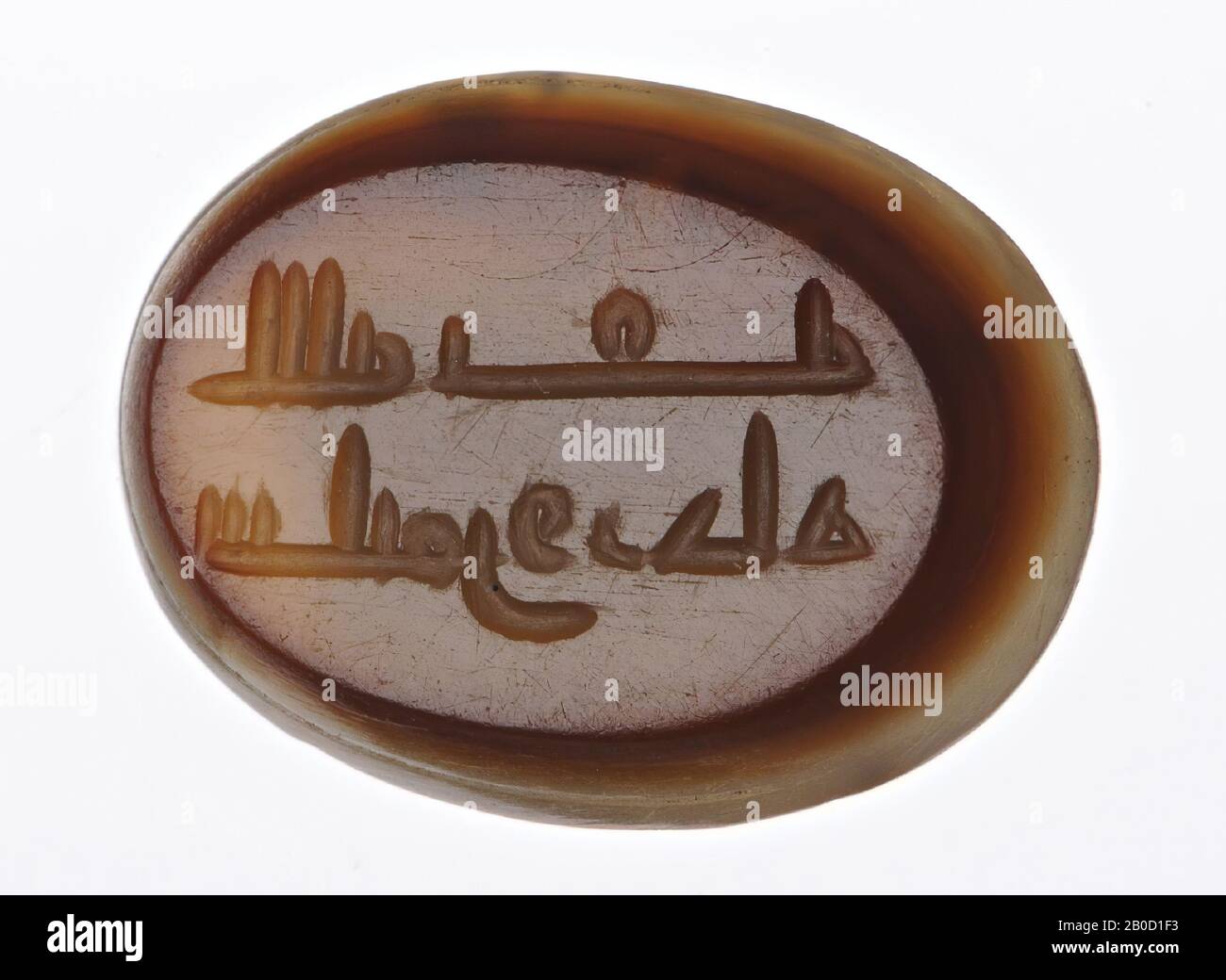 Vz: Arabic text in 2 lines: God is with him Suliman Wargah, gem, intaglio, agate, Color: dark brown Stock Photo