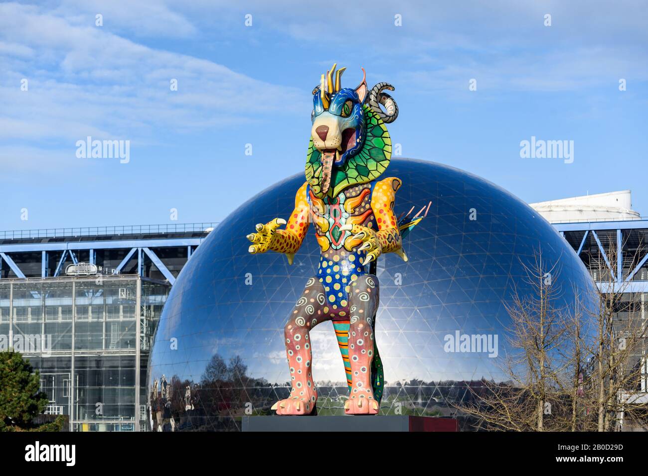 Mexican folk art brightly colored sculpture of fantastical creature called 'Alebrije' is exhibited in the Parc de la Villette in Paris. Stock Photo