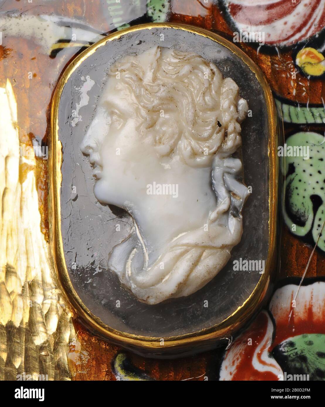 Vz: the woman wears a garment that falls relatively high around her neck, she wears a hair ribbon and diadem in her hair., Cameo, chalcedony (?), Color: gray-brown Stock Photo