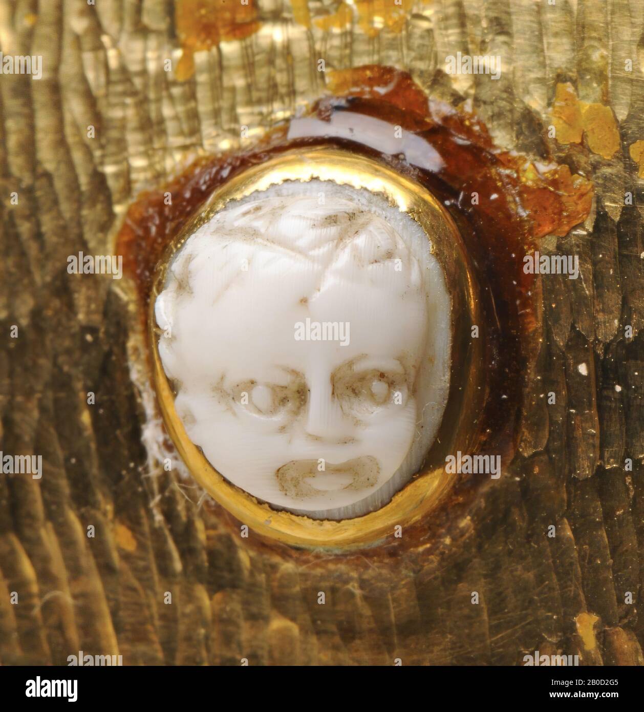 Vz: roughly shaped head of a child with full hair., Cameo, chalcedony (?), Color: gray Stock Photo