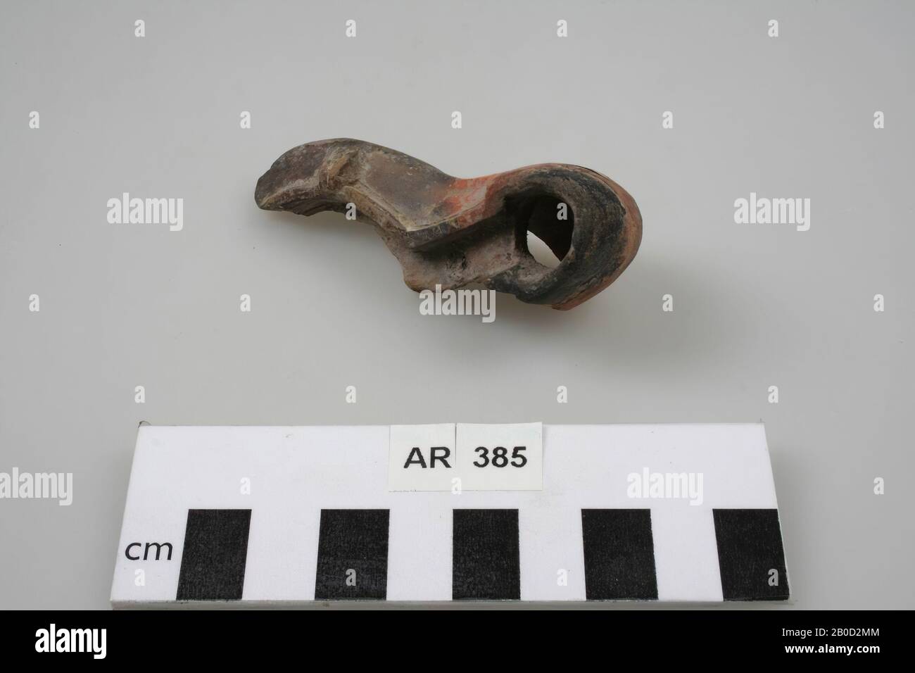 Fragment of an earthenware oil lamp, with spout and filler hole, oil lamp, fragment, earthenware, 7,8 x 3 cm, roman, Netherlands, South Holland, Leidschendam-Voorburg, Voorburg, Arentsburg Stock Photo