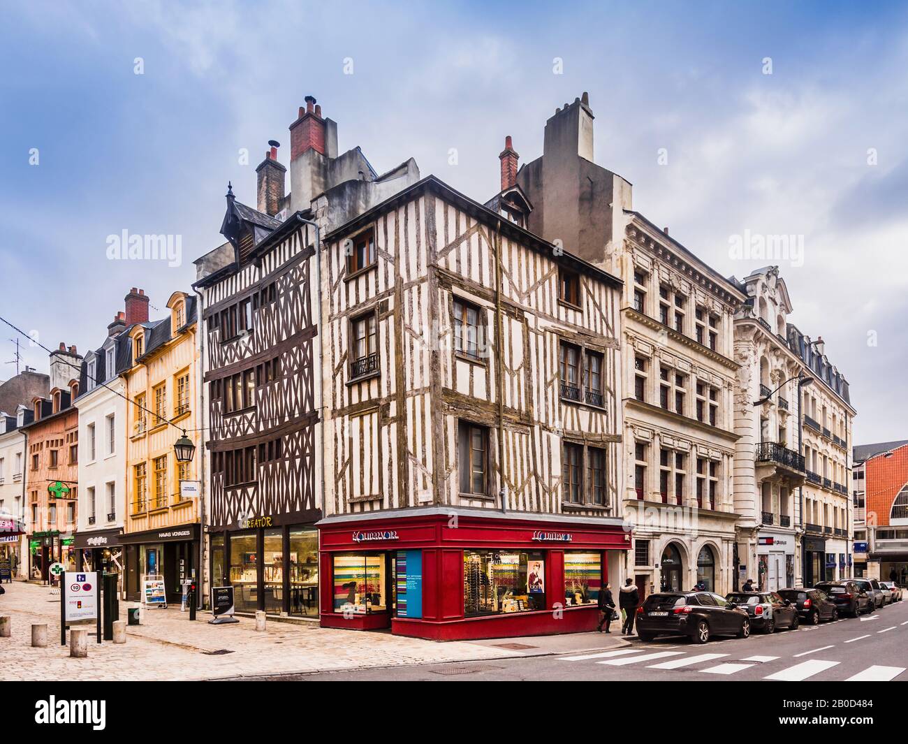 Modern businesses and old half-timbered buildings in centre of Orleans ...