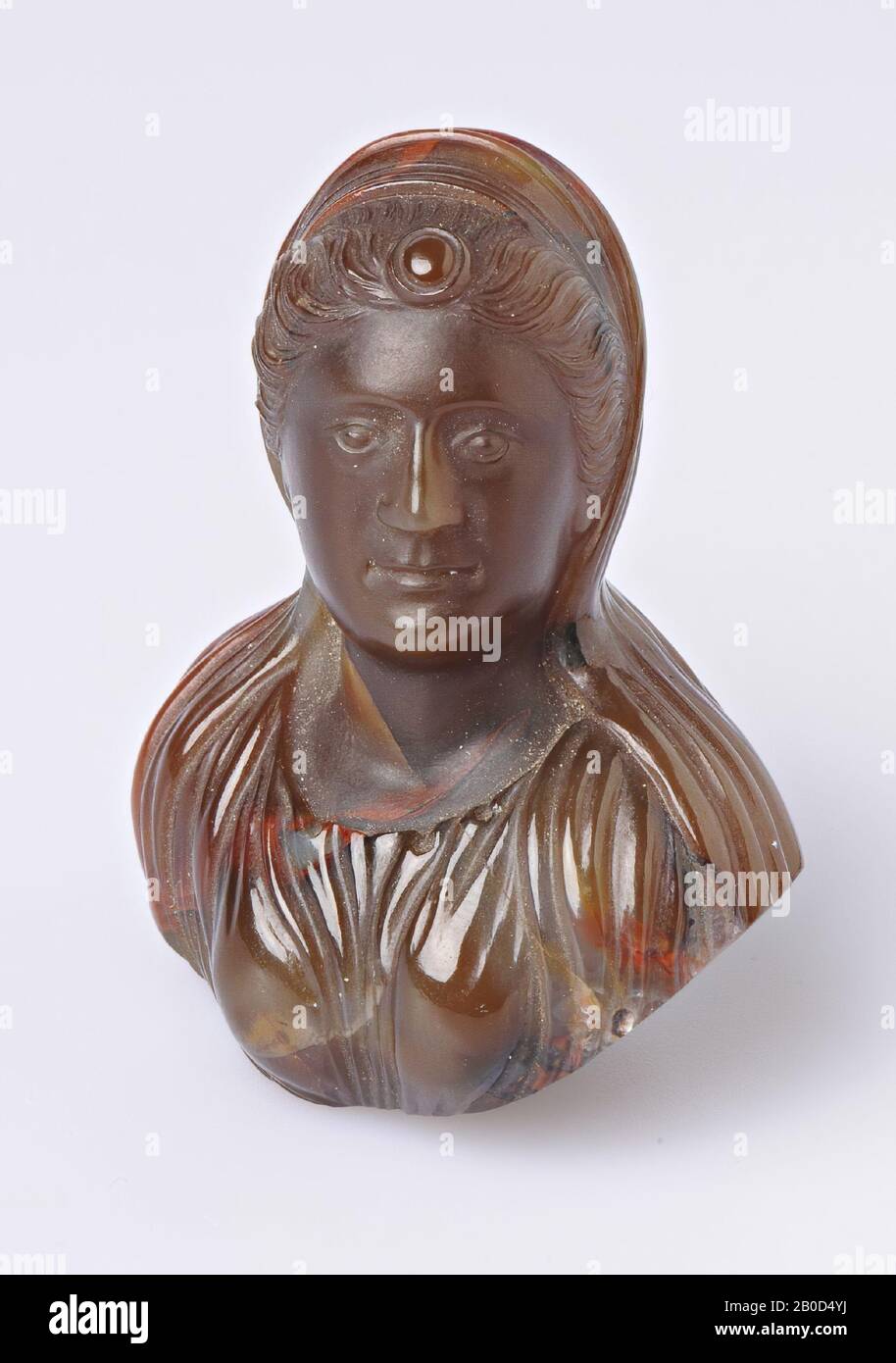 woman in roman clothing with veil, tiara and medaillion on forehead, decorative bust, stone, Color: brown with red veining, Form: bust, Machined: hole at bottom for fastening, Type:, 44 x 53 mm, 16th Stock Photo