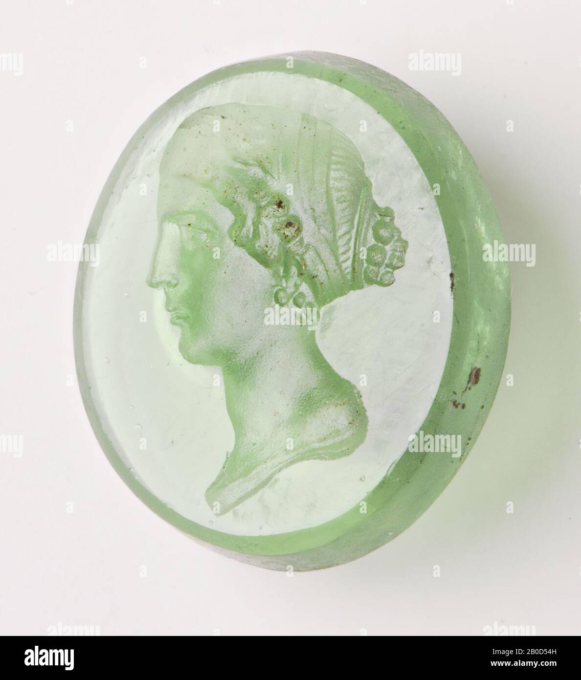 Vz: the woman has a long neck and a hairdress in which a number of bands have been processed., Gem, intaglio, unknown, Color: light green, Shape: oval, Processing: edge at front cut backwards compared to at the back , 13 x 16 x 3 mm Stock Photo