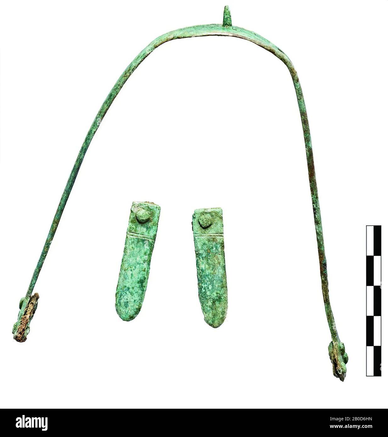 Small copper alloy strap with one rivet, decorated with two grooves. Leather remains attached. Associated with spur 114.c1. This is the specimen lying on the left side., Belt tongue, metal, bronze, width: 4 mm, vmeb 550-700, Netherlands, North Brabant, Bergeijk, Bergeijk, Fazantlaan Stock Photo