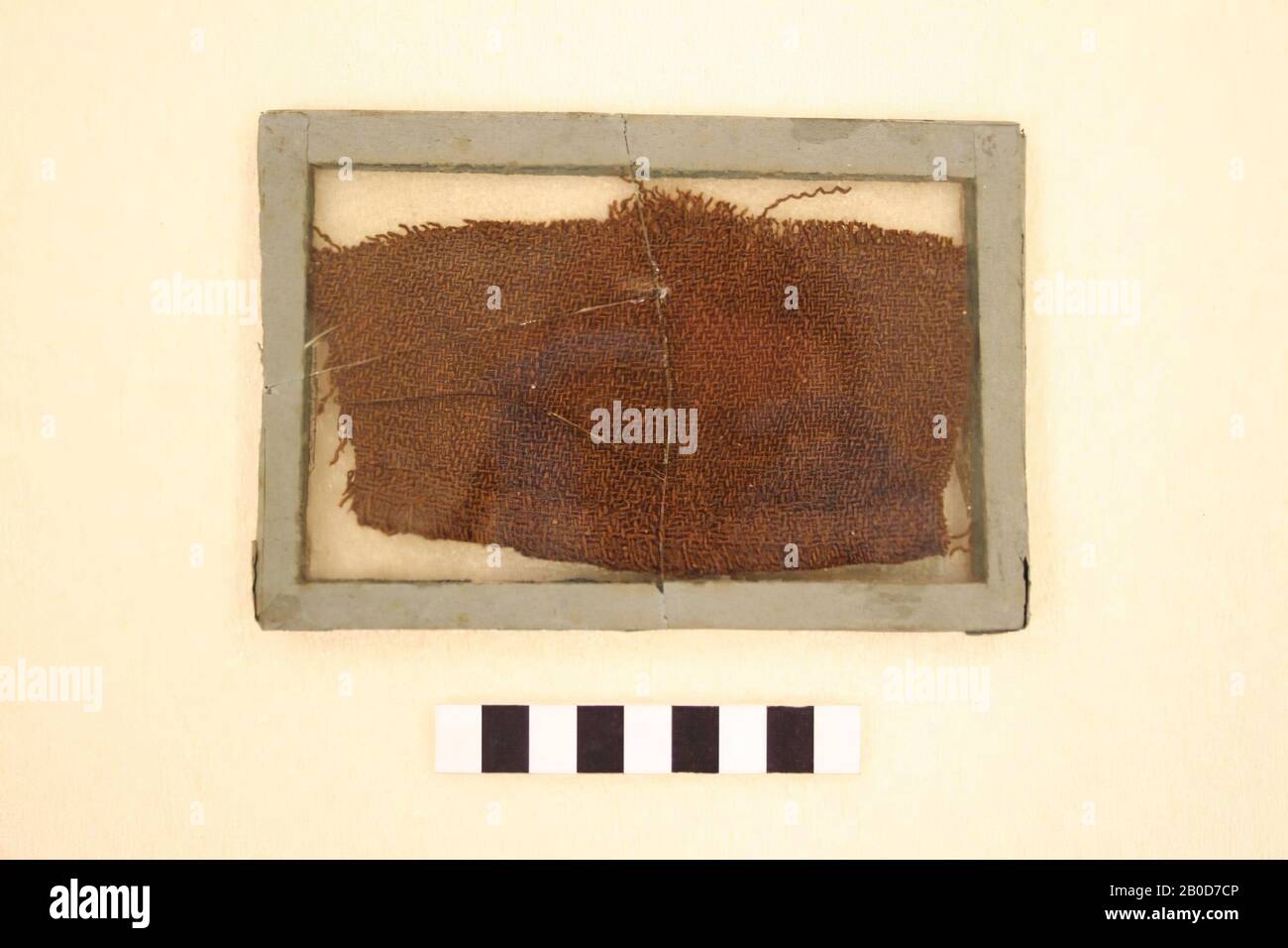 Lap textile in a broken glass frame. On the glass incorrectly marked EG 2, textile, organic, wool, Germany Stock Photo
