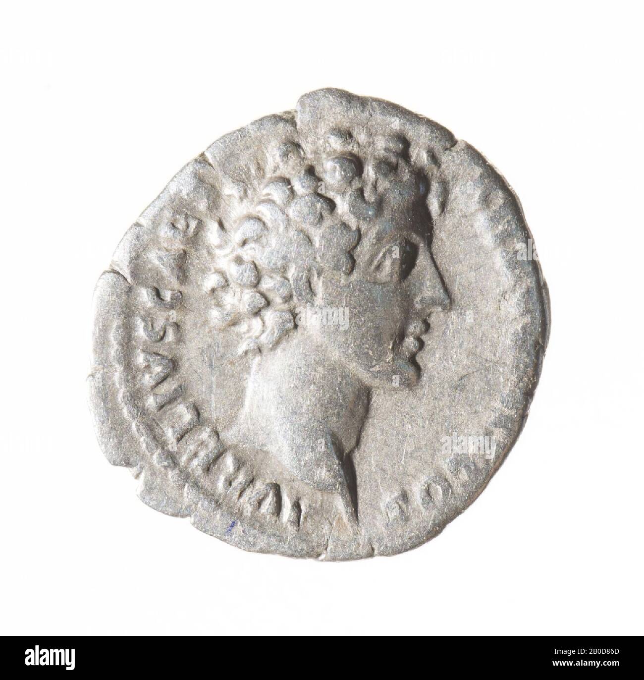 Obverse: Marcus Aurelius, right. Worn, remains of inscription: AVRELIVS CAESAR AVG PII F COS. Reverse: attributes of a priest: knife, sprinkler, can, lituus and simpulum. Worn, remains of inscription: PIETAS AVG., Coin, denarius of Marcus Aurelius under Antoninus Pius, metal, silver, diam: 1,6 cm, wt. 2.95 grams, 140-144 AD, unknown Stock Photo
