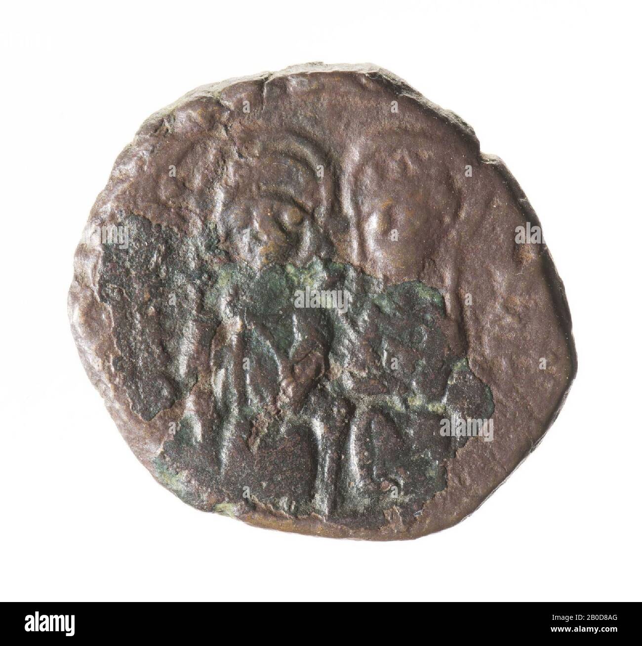Front: Justin and Sophia, sitting on throne, both with nimbus. Justinus holds the world globe with cross and Sophia with right scepter with cross. Worn, remains of inscription. Reverse: Large K, ANNO left, star above, regnal year right, under gamma. The large (Greek) letter stands for a number and indicates the coin value. K is 20 nummi, a half follis. The lowercase letter refers to the workshop where the coin is minted., Coin, half follis of Justin II, Byzantine, metal, bronze, diam: 2,1 cm, wt. 7.07 grams, 565-578 AD, unknown Stock Photo