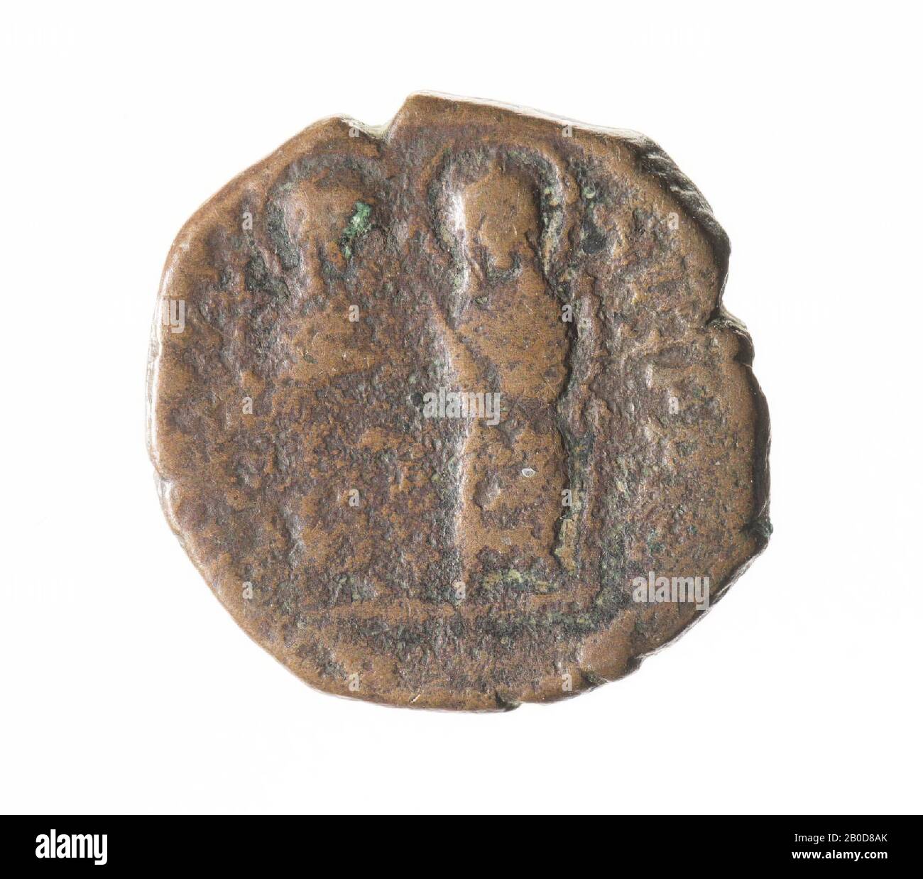 Front: Justin and Sophia, sitting on throne, both with nimbus. Justinus holds the world globe with cross and Sophia with right scepter with cross. Worn, remains of inscription. Reverse: Large K, ANNO left, cross top, government year right, TES bottom. The large (Greek) letter stands for a number and indicates the coin value. K is 20 nummi, a half follis. The letters at the bottom refer to the place where the coin is minted., Mint, half follis of Justin II, Byzantine, metal, bronze, diam: 1.9 cm, wt. 5.47 grams, 565-578 AD, unknown Stock Photo